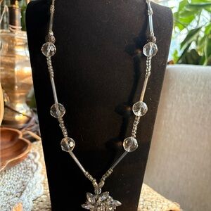 Elegant Art Deco style beaded necklace with rhinestone flower pendant
